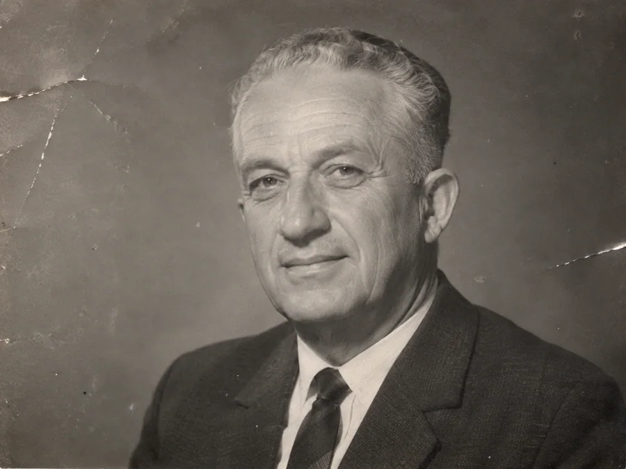 A 1960s studio portrait of an older man — illustrative before photo