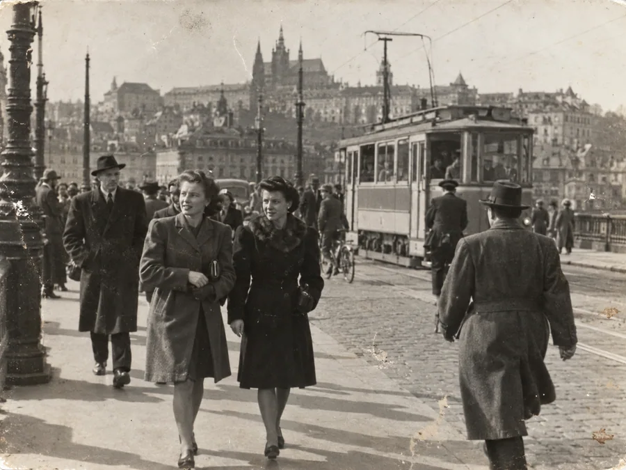 A 1940s city street with a tram and pedestrians — illustrative before photo