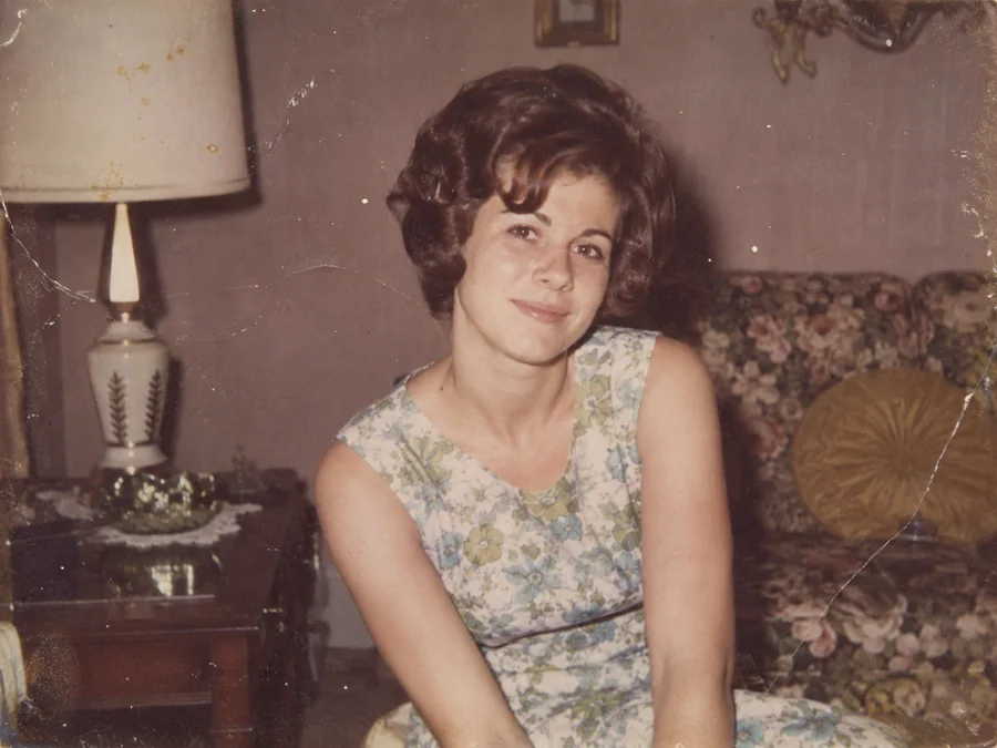 A faded 1960s color portrait of a young woman — illustrative before photo